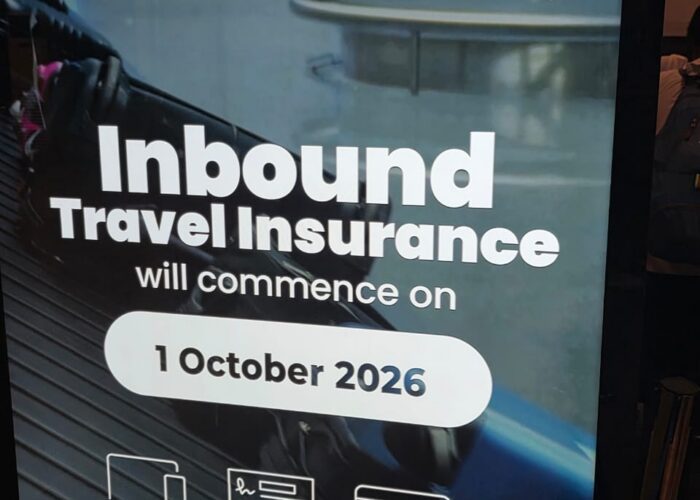 Official National Insurance Corporation sign announcing mandatory Tanzania travel insurance starting October 2026